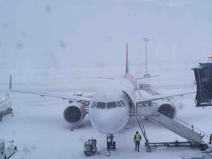 Daniel Roszak at the airport in Poland, waiting through a four-hour flight delay